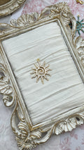 Sol charm in gold